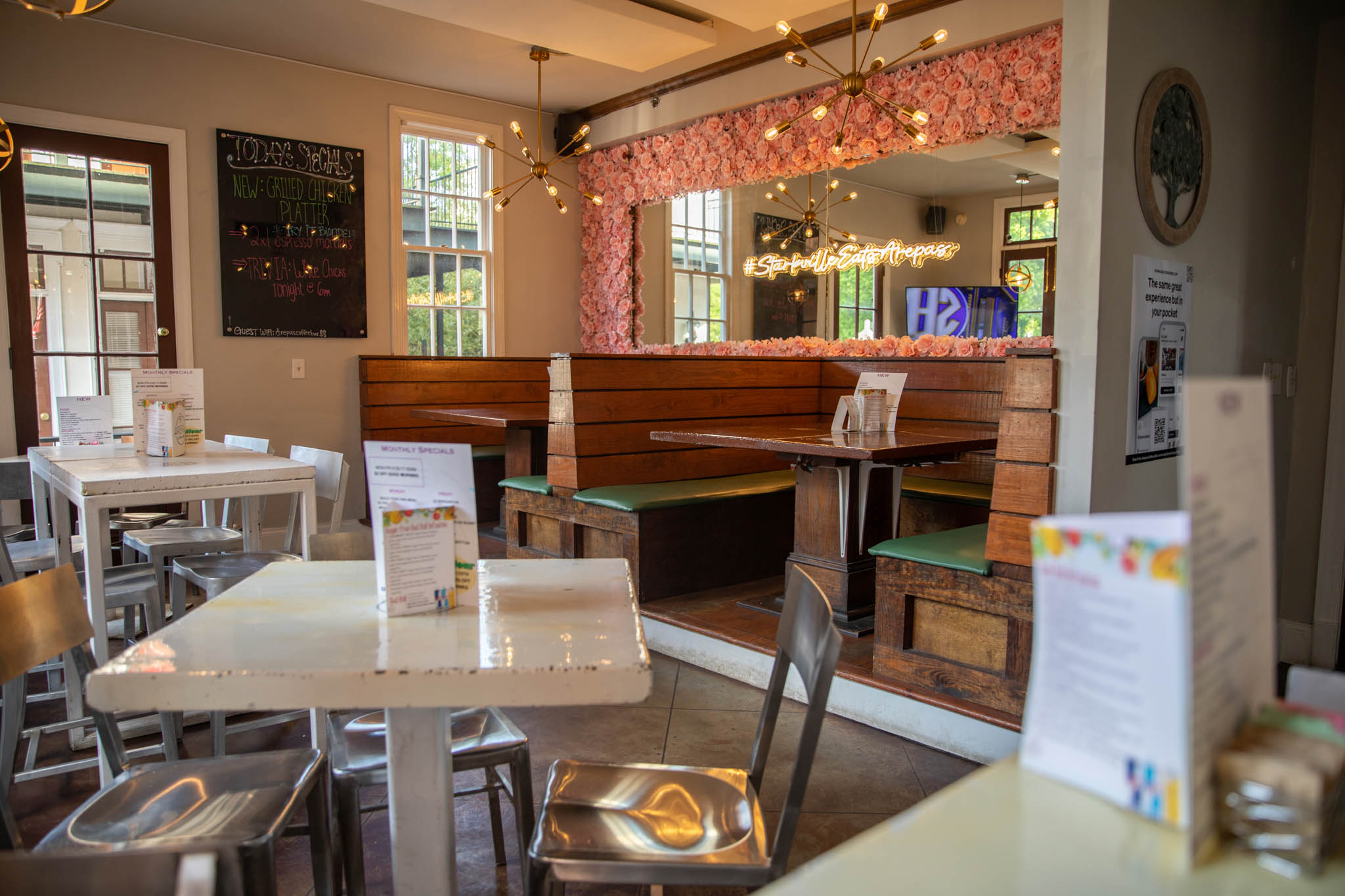 Image of empty tables and chairs at a restaurant.