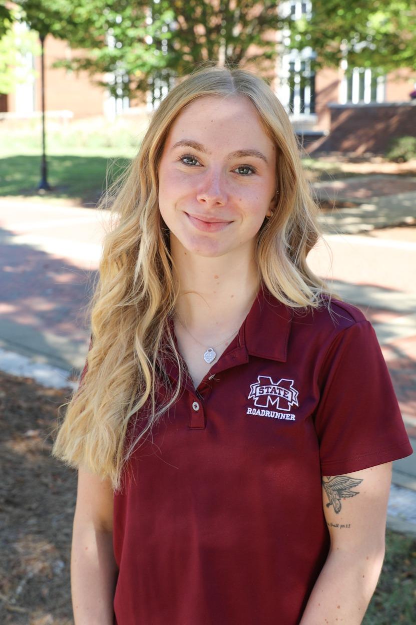 Liz Williams smiling in front of Montgomery Hall.