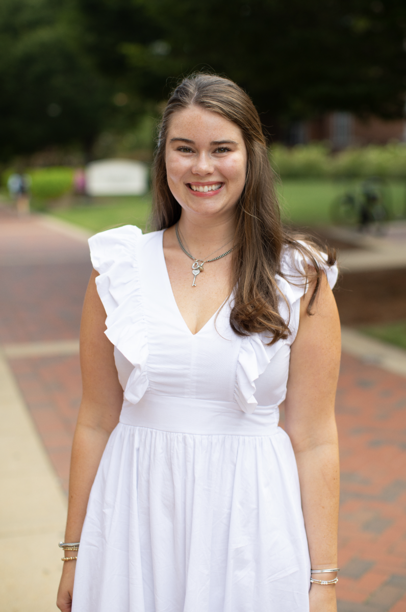 Photo of Carolyn Kate standing in front of Montgomery Hall 