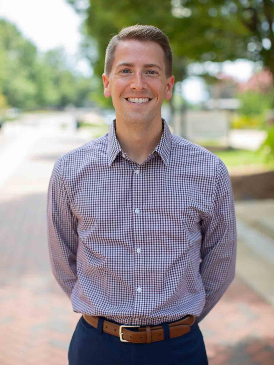 Mississippi State University professional headshot of a man with brown hair wearing a maroon button down.
