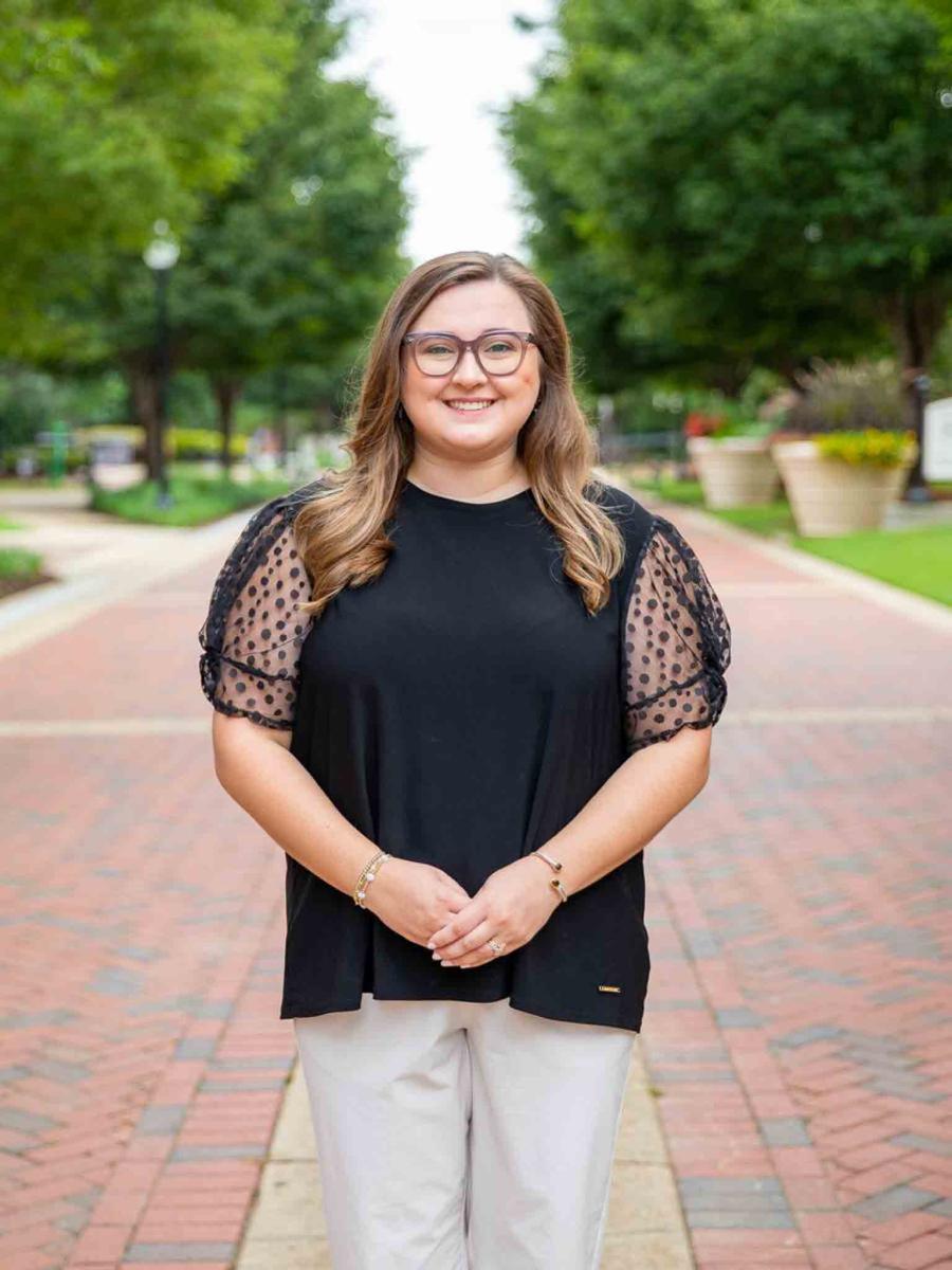 Mississippi State University professional headshot of a woman with brown hair wearing a black top.