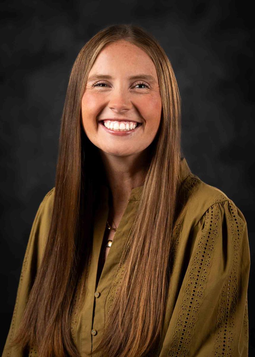 Caroline Cunningham, Mississippi State University Undergraduate Admissions Project Coordinator, smiling at the camera in a headshot style image. 